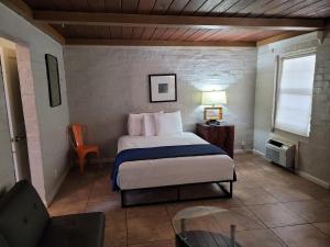 a bedroom with a bed and a table and a chair at Sterling Gardens in Las Vegas +43 photos