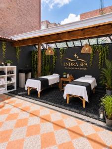 a pavilion with beds and a sign that reads india spa at Ortega La 33 Hotel y Spa in Medellín