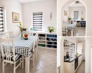 a kitchen and dining room with a table and chairs at Manda Gradac in Gradac