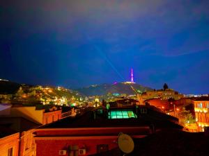 a view of a city at night at Mit Hotel Tbilisi in Tbilisi City
