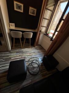 a living room with two chairs and a table at Boutique Central Square Hostel in Trogir