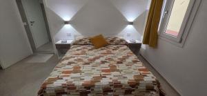 a bedroom with a large bed with two night stands at Bardia Guest House in Dorgali
