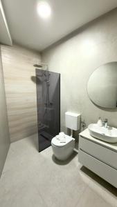 a bathroom with a toilet and a sink and a mirror at Villa Maja in Blagaj +27 photos