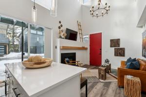 a kitchen and living room with a fireplace at Quarry A35 in Whitefish