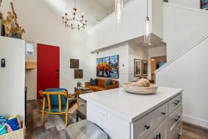 a kitchen with a white counter and a dining room at Quarry A35 in Whitefish