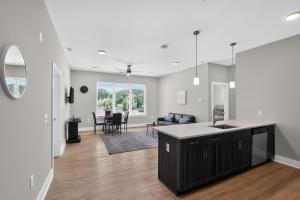 a kitchen and living room with a counter top at Parkview Greer 2BR Getaway in Greer