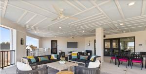a living room with couches and a ceiling fan at Parkview Greer 2BR Getaway in Greer