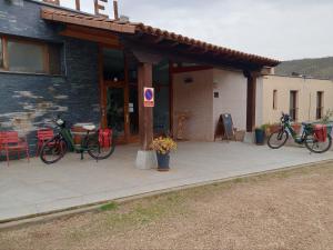 a group of bikes parked outside of a building at Hotel Rural Porta Coeli - Dehesa Santa Lucía in San Martín del Castañar