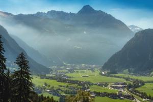 a view of a valley with mountains in the background at Alpine Residence by alpenappartements in Mayrhofen