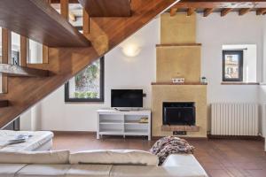 a living room with a couch and a fireplace at I Balconi in Iseo
