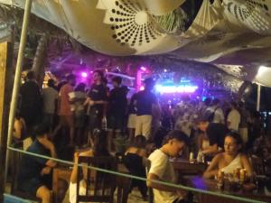 a crowd of people standing in a bar at Aaliya Bay in Pottuvil