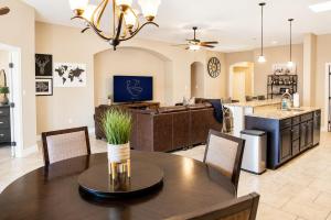a kitchen and living room with a table and chairs at The Palo Pinto in Alamogordo
