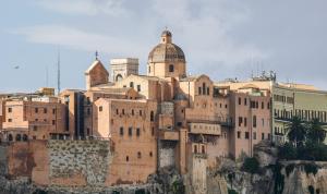 a building on the side of a mountain at Martini Castello Boutique Apartments - Historic Center & Lift in Cagliari