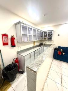a kitchen with a counter and a fire hydrant at شاليهات زارا Zare in Taif