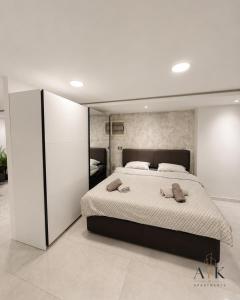 a bedroom with a large bed in a room at ATK apartment in Koper