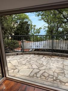 a view of a patio from a window at Vila Srna in Petrovac na Moru