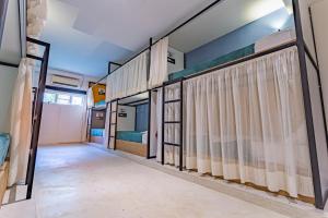 a row of bunk beds in a dorm room at URB Hotel in Fortaleza
