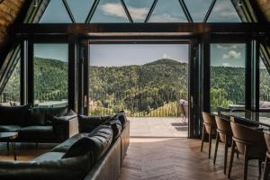 a room with a view of a mountain at The Frame Croatia in Ravna Gora