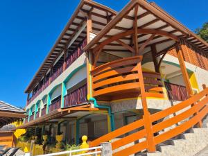 a building with a staircase on the side of it at Résidence Simona Premium in Deshaies