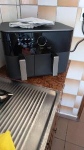 a toaster oven sitting on top of a counter at Pansion Panorama in Skala Marion