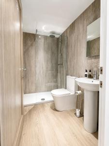 a bathroom with a toilet and a sink and a shower at Looking for long term rentals; huge discount. Caithness. in Lybster