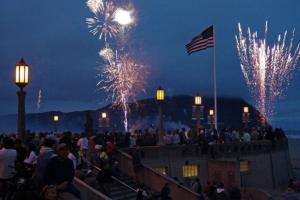 a large crowd of people watching fireworks at night at Seaside Ocean Front Condo in Seaside