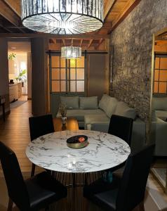 a living room with a table and a couch at Zen Casa House in Gijón