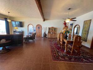 a living room with a table and a dining room at Ocean Front Baja Vacation in Rosarito