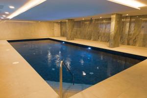 a large swimming pool in a building with at Victory Suites in Gibraltar