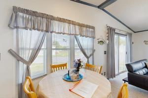 a dining room with a table and a large window at Assateague Point - Bay Breeze in Berlin +22 photos