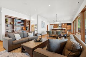 a living room with a couch and a table at Rivers End Lake House in Bigfork