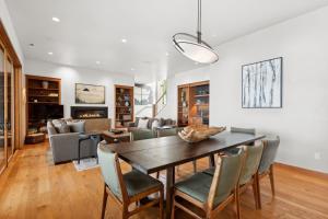 a dining room with a table and chairs at Rivers End Lake House in Bigfork