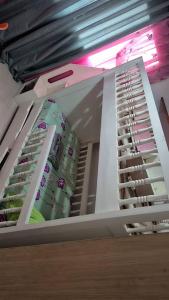 a room with a rack of wine bottles at Appart Bougainvillier in Libreville