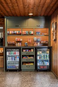 a refrigerator filled with lots of food and drinks at Ayres Lodge Alpine in Alpine