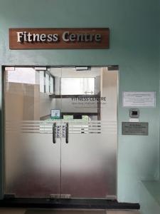 a entrance to a fitness centre with a metal door at Panbil Residence Apartment - Studio 2 Bed in Bagam