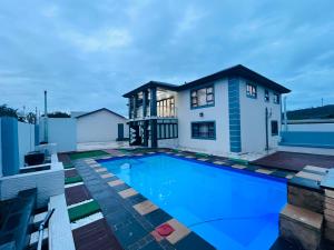 a house with a swimming pool on a roof at Kumnandi Guesthouse in Beacon Bay