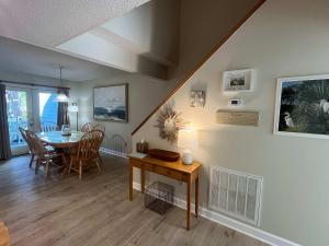 a living room with a table and a dining room at Egrets Pointe, Unit 492 in Edisto Island