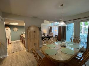 a kitchen and dining room with a table and chairs at Egrets Pointe, Unit 492 in Edisto Island