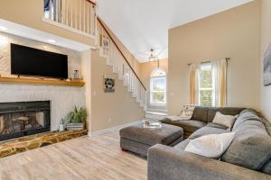 a living room with a couch and a fireplace at Heh Edisto in Edisto Beach