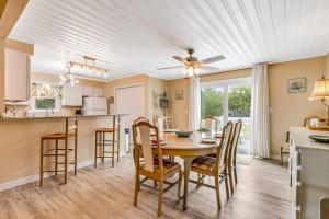a kitchen and dining room with a table and chairs at Heh Edisto in Edisto Beach