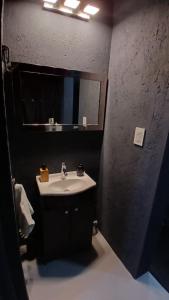 a bathroom with a sink and a mirror at MiCASA in Córdoba +22 photos