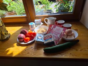 a table with a bunch of fruits and vegetables on it at Statek VRANČ - U Kačenky in Bítov +7 photos