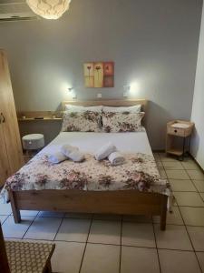 a bedroom with a bed with two towels on it at Barbara Studios in Skala Potamias