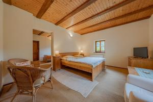a bedroom with a bed and a tv in it at Apartmány Stodola in Malá Morávka
