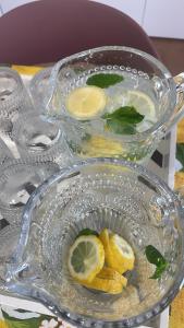 a glass bowl with lemon slices on a table at U Minnulitu in Caltagirone