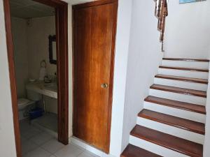 a stairway leading to a bathroom with a stair case at Cantamar 401, huge condo , incredible views, Sargassum Free in Cozumel +17 photos
