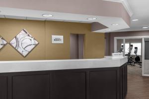 an office lobby with a reception counter and a sign on the wall at Residence Inn by Marriott Albuquerque North in Albuquerque +41 photos