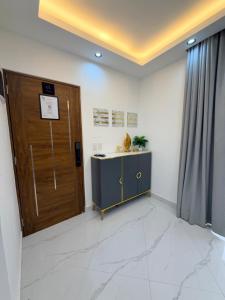 an office with a wooden door and a desk at Luxury NEW Stylish apartment Bayahibe with pool in Bayahibe +18 photos