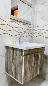 a bathroom with a sink and a mirror at Norita Luxury Camp in Wadi Rum