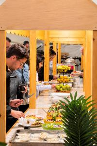 a group of people standing around a table with food at Norita Luxury Camp in Wadi Rum +58 photos